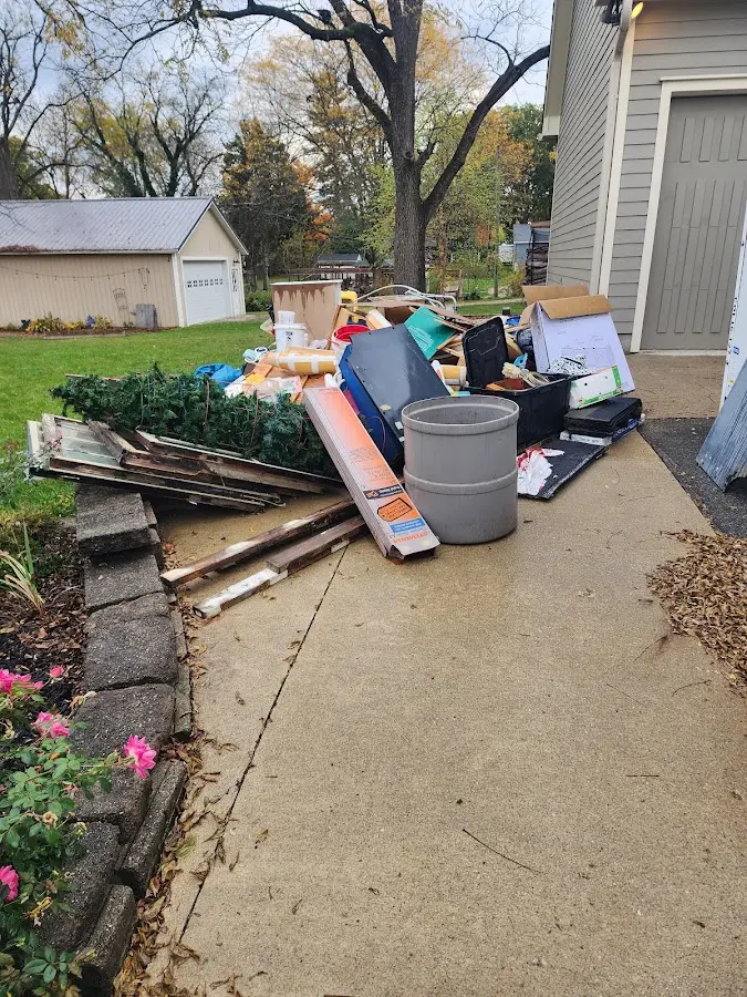 Dumpster being loaded with debris for Residential Dumpster Rental in Taft